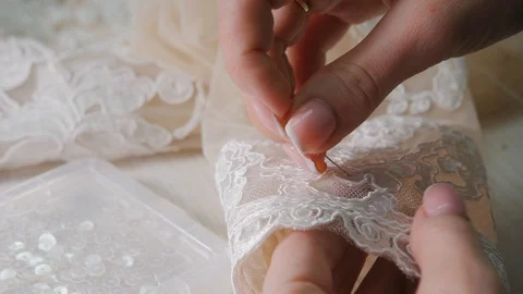 Close-up of needle and thread, embroider pattern. Equipment for sewing elegant Stock Footage 89851853