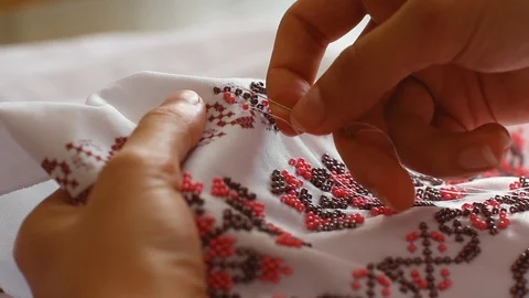 Close-Up Of Needle And Thread, Embroider Patterns With Beads. Handmade sewing Stock Footage 116430796