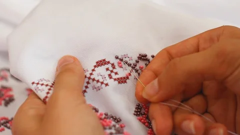Close-Up Of Needle And Thread, Embroider Patterns With Beads. Handmade sewing Stock Footage 116431135