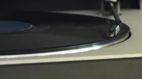 Close-up of a Needle Dropping on A Vinyl Record Stock Footage 130680278
