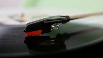Close up of needle on spinning black and white record Stock Footage 85363762