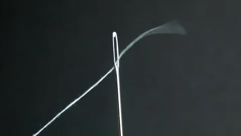 Close up needle with white thread, preparation for sewing. Stock Footage 109043250