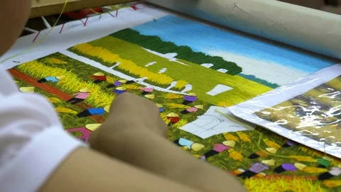 Close up of a needlework landscape being made at hong ngoc handicraft center Stock Footage 77559937