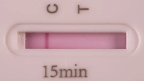 Close up of a Negative COVID-19 (Corona) Rapid Antigen Test in a few seconds Stock Footage 156300568