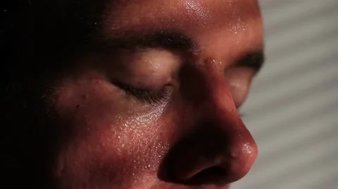 Close up of a nervous, agitated man sweating Stock Footage
