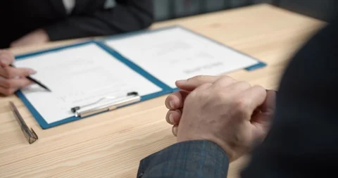 Close up nervous man's hands during job interview Stock Footage 125498128