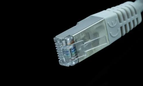 Close-up of a network cable connector.  High-detail image showing the RJ45 .. Stock Photos