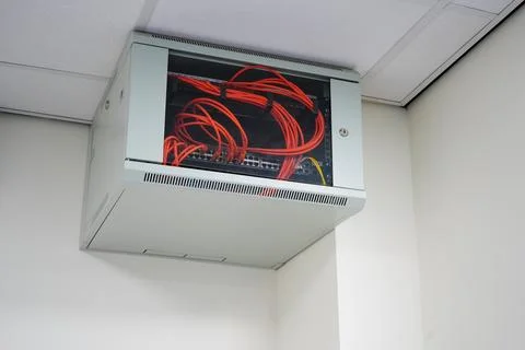 Close up of a network switch cabinet on a wall Stock Photos