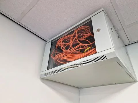 Close up of a network switch cabinet on a wall Stock Photos
