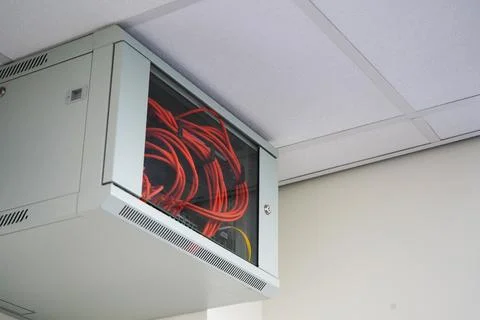 Close up of a network switch cabinet on a wall Stock Photos
