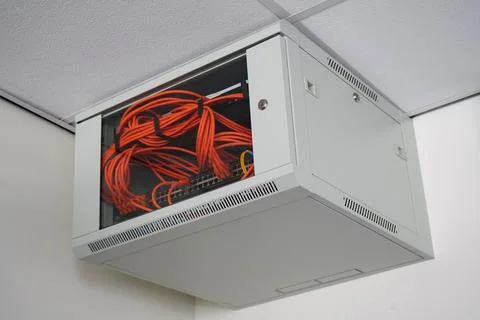 Close up of a network switch cabinet on a wall Foto stock