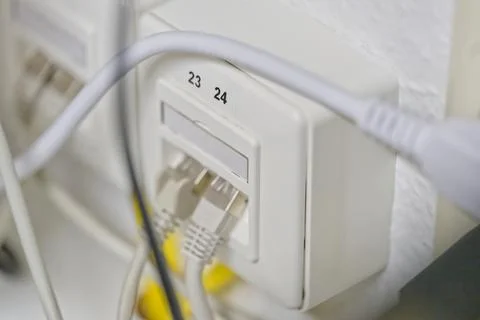 Close-up of Network Wall Socket with Ethernet Cables Stock Photos