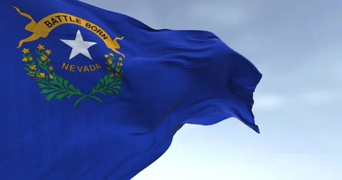 Close-up of Nevada state flag waving in the wind on a clear day Stock Footage 261058182