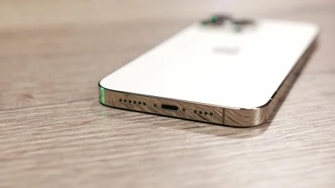 Close-up of new Apple iphone 14 Pro Max phone in Gold color. Stock Footage 219190688