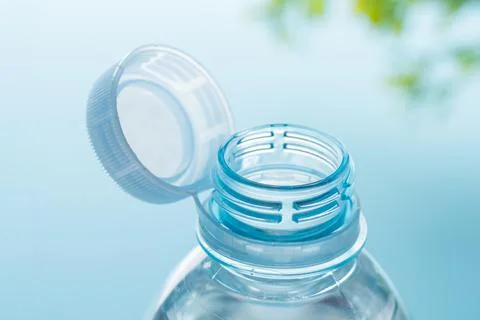 Close up of new cap attached to plastic bottle, connected to the neck of the  Stock-Fotos