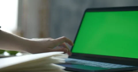 Close up a new computer. Green chroma key on the screen Stock Footage 334419554