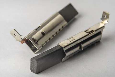 Close-up of new electric brushes for replacement in the electric motor Foto stock