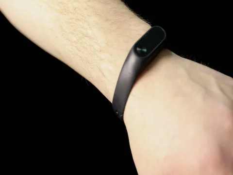 Close up of a new gadget dressed for a man's hand. Stock Footage 73092338