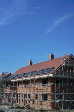 Close Up Of New Housing Development Including Solar Energy Panels On Roof Stock Photos