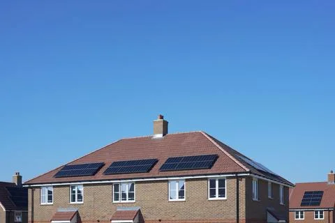 Close Up Of New Housing Development Including Solar Energy Panels On Roof Stock Photos