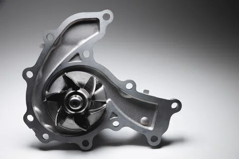 Close-up of a new internal combustion engine cooling water pump on a gray Stock Photos