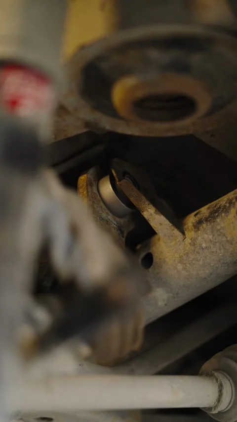 Close-up of a new silver bushing installed in rusty suspension Stock Footage 337567781