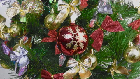 Close up of new year decorations on green christmas tree Stock Footage 146908056