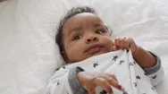 Close Up Of Newborn Baby Boy Lying On His Back And Looking Around Stock Footage