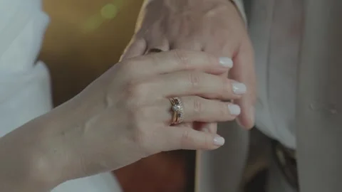 Close-up of the newlyweds' hands with a ring. Stock Footage 340569313