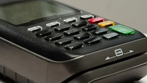 Close up of NFC terminal in the shop. Macro shot of Men pays by card in banking Stock Footage 231238640