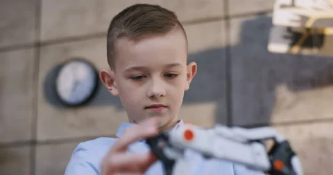 Close up of the nice smart and curious little Caucasian boy in the blue shirt Stock Footage 135841873
