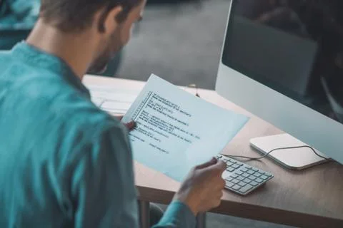 Close up of a nice young man reading the code Photos