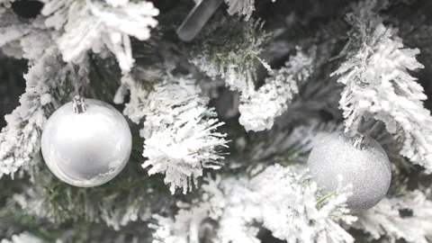A close up night shot of a Christmas tree covered in snow. Stock Footage 256587524