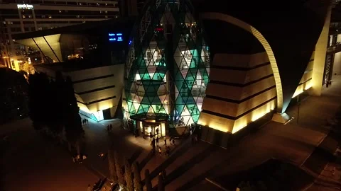 Close-up Night View of the Modern Egg-shaped Glass Building Stock Footage 239166287