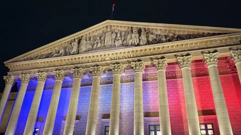 Close-up night view of the National Assembly in Paris, lit in blue, white, and Stock Footage 325714209