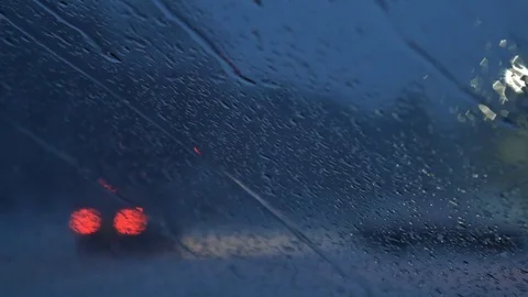 Close-up at night Windshield While Snowing and Raining Outside. Stock Footage 101518215
