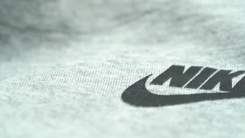 Close up of Nike logo on gray fabric textile. Toronto, Canada - March 11, 2026. Stock Footage 331695498