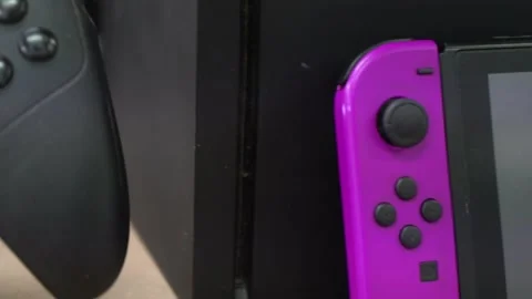 Close Up Of Nintendo Switch and Xbox Moving Backwards 2 - Moving Controller Stock Footage 244281553