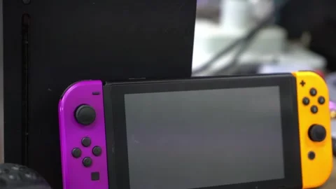 Close Up Of Nintendo Switch and Xbox Moving Backwards Stock Footage 244281623