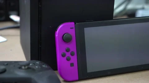 Close Up Of Nintendo Switch and Xbox Moving Forward Stock Footage 244282079