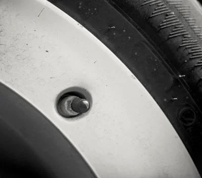 Close-up nipples wheels car. Tyre valve Stock Photos