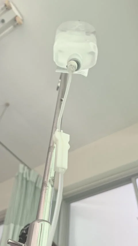 Close Up Normal Saline IV Drip Infusion for Patient Hydration and Medical Care Stock Footage 328307388