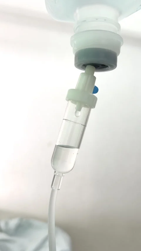 Close Up Normal Saline IV Drip Infusion for Patient Hydration and Medical Care Stock Footage 328307418