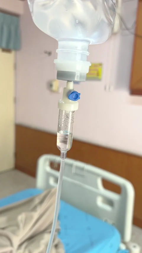 Close Up Normal Saline IV Drip Infusion for Patient Hydration and Medical Care Stock Footage 328386903