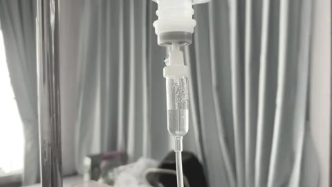 Close Up Normal Saline IV Drip Infusion for Patient Hydration and Medical Care Stock Footage 328386917