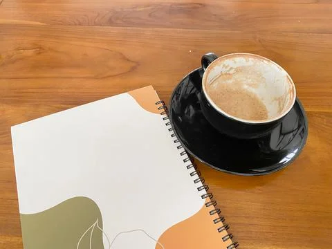 Close up note book and chic empty black cup Stock Photos