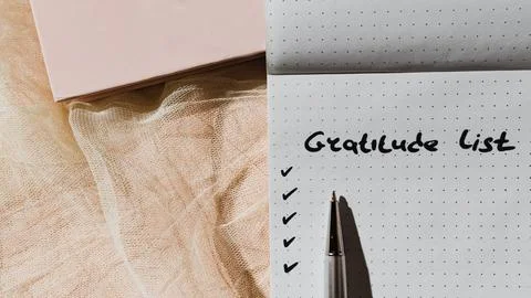 Close-up of notebook or personal diary with handwritten text "Gratitude list" Stock Photos