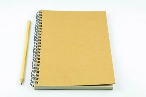 Close notebook with pencil on white background Stock Photos