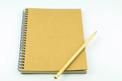 Close notebook with pencil on white background Stock Photos