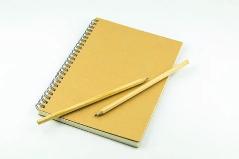 Close notebook with pencil on white background Stock Photos